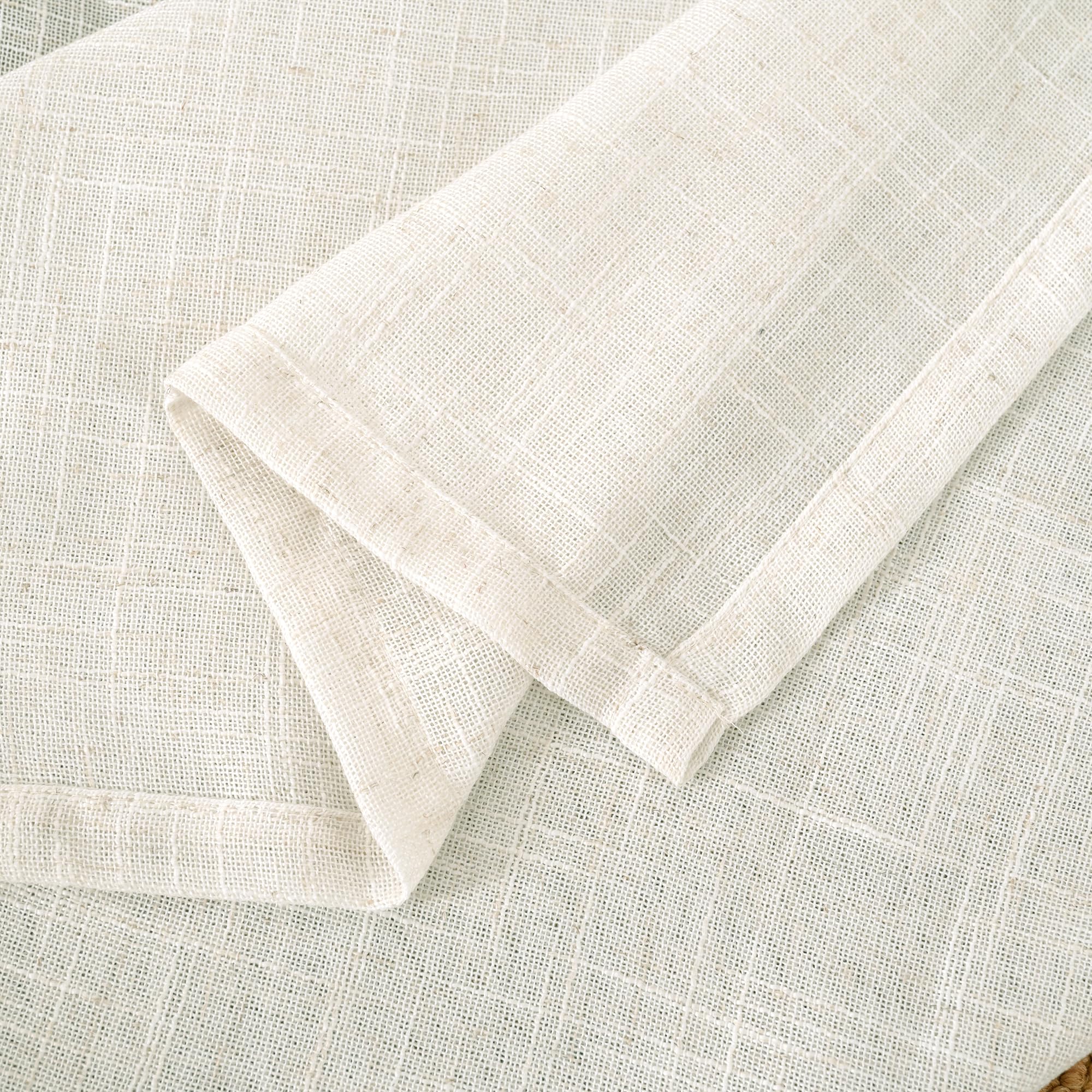 LAMIT draped over bed in bedroom lifestyle shot conveying cozy, breathable atmosphere