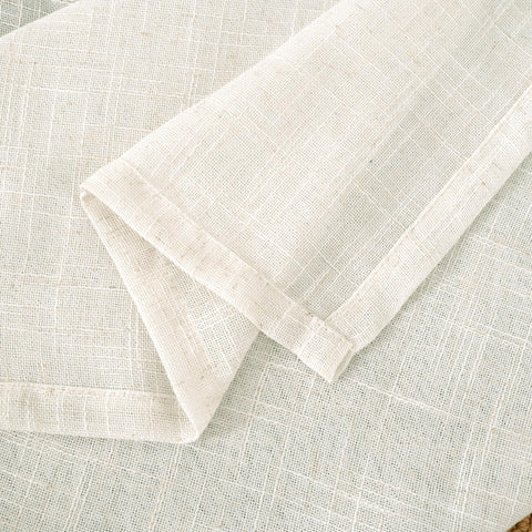 LAMIT draped over bed in bedroom lifestyle shot conveying cozy, breathable atmosphere