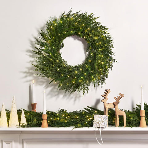 LampLust garland wrapped on staircase bannister showing easy installation and charm