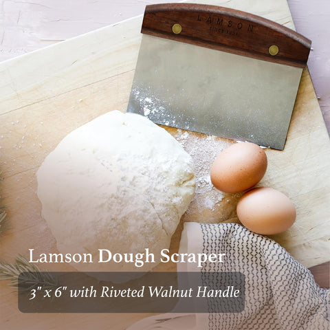 Lamson lifting chopped vegetables from board to pan for efficient transfer