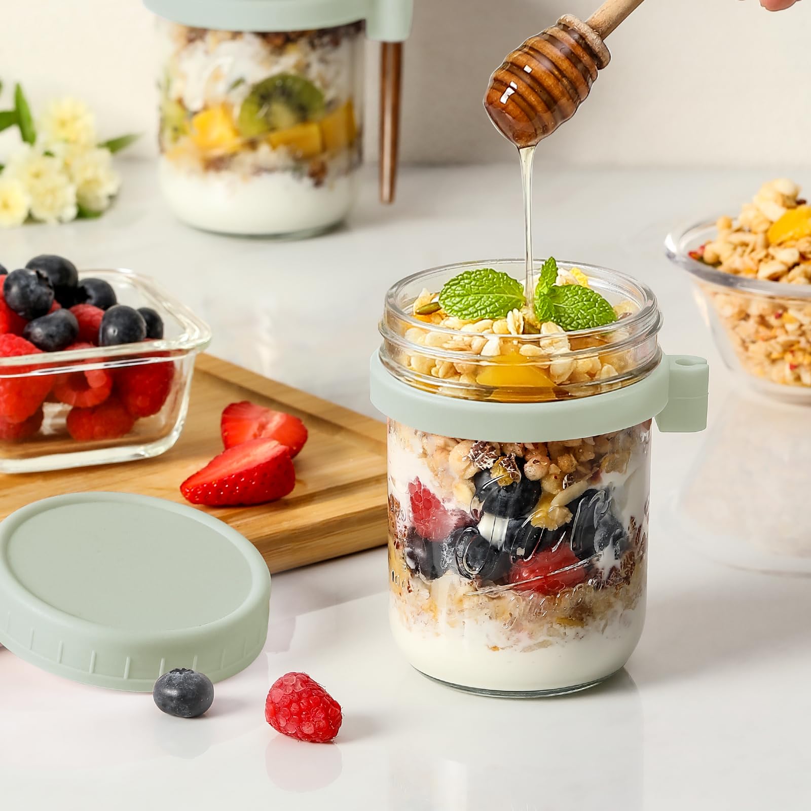 LANDNEOO jar with spoon in silicone holder showing attached utensil for eating on-the-go