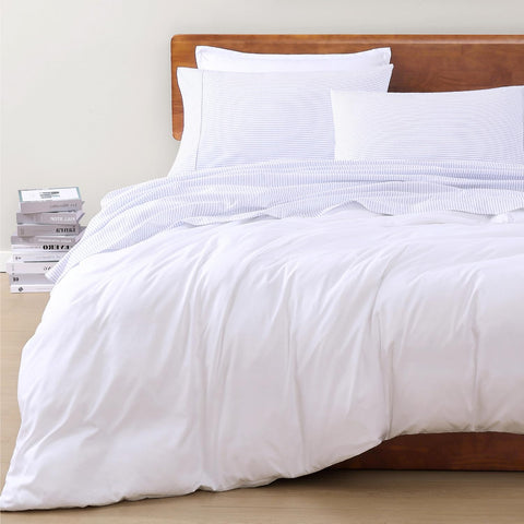 lane linen made bed in styled bedroom showing tidy hotel-style look