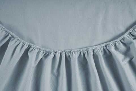 LANE LINEN flat sheet folded to show smooth drape and generous sizing