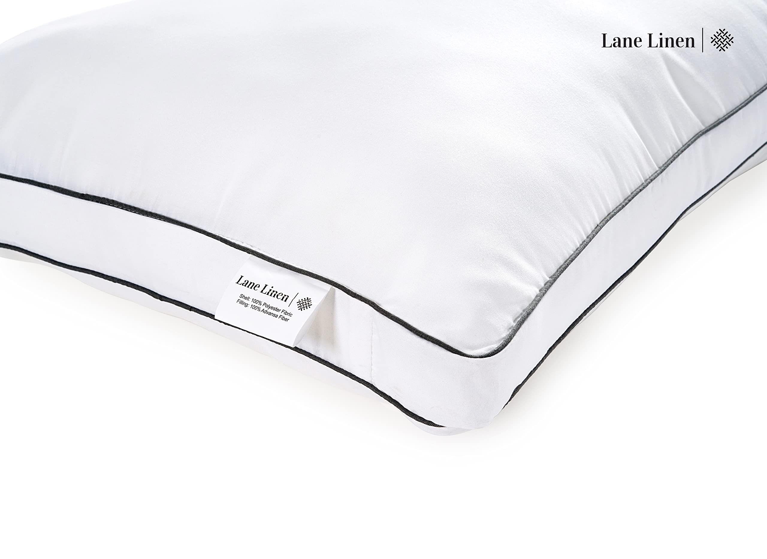 LANE LINEN two pillows styled on made bed showing hotel-like loft and comfort