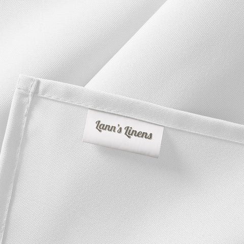 Lann's Linens beside chair illustrating 90x156 inch scale coverage