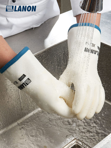 LANON mitt next to a hand for scale and large fit assurance