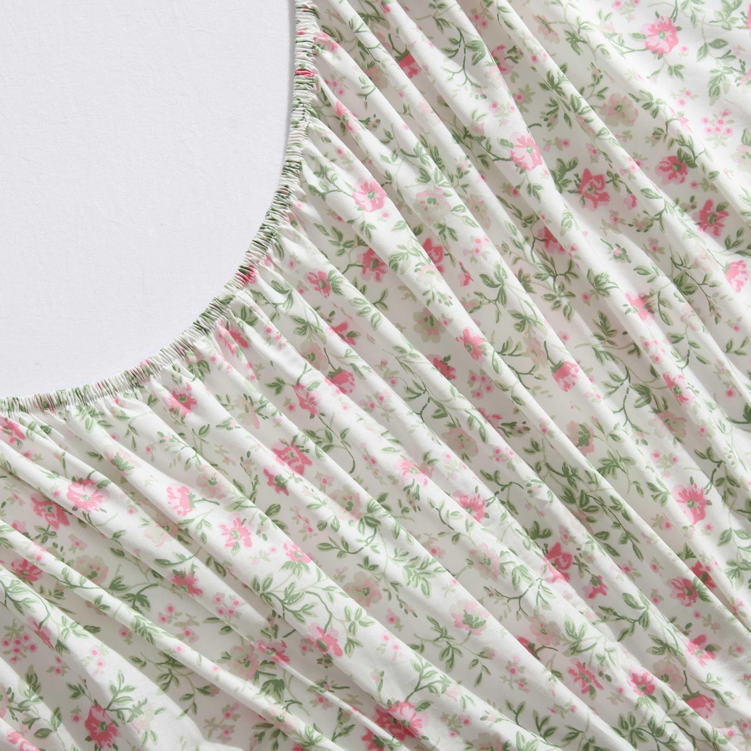 Laura Ashley styled bed with Bonnie Pink sheets demonstrating romantic bedroom styling