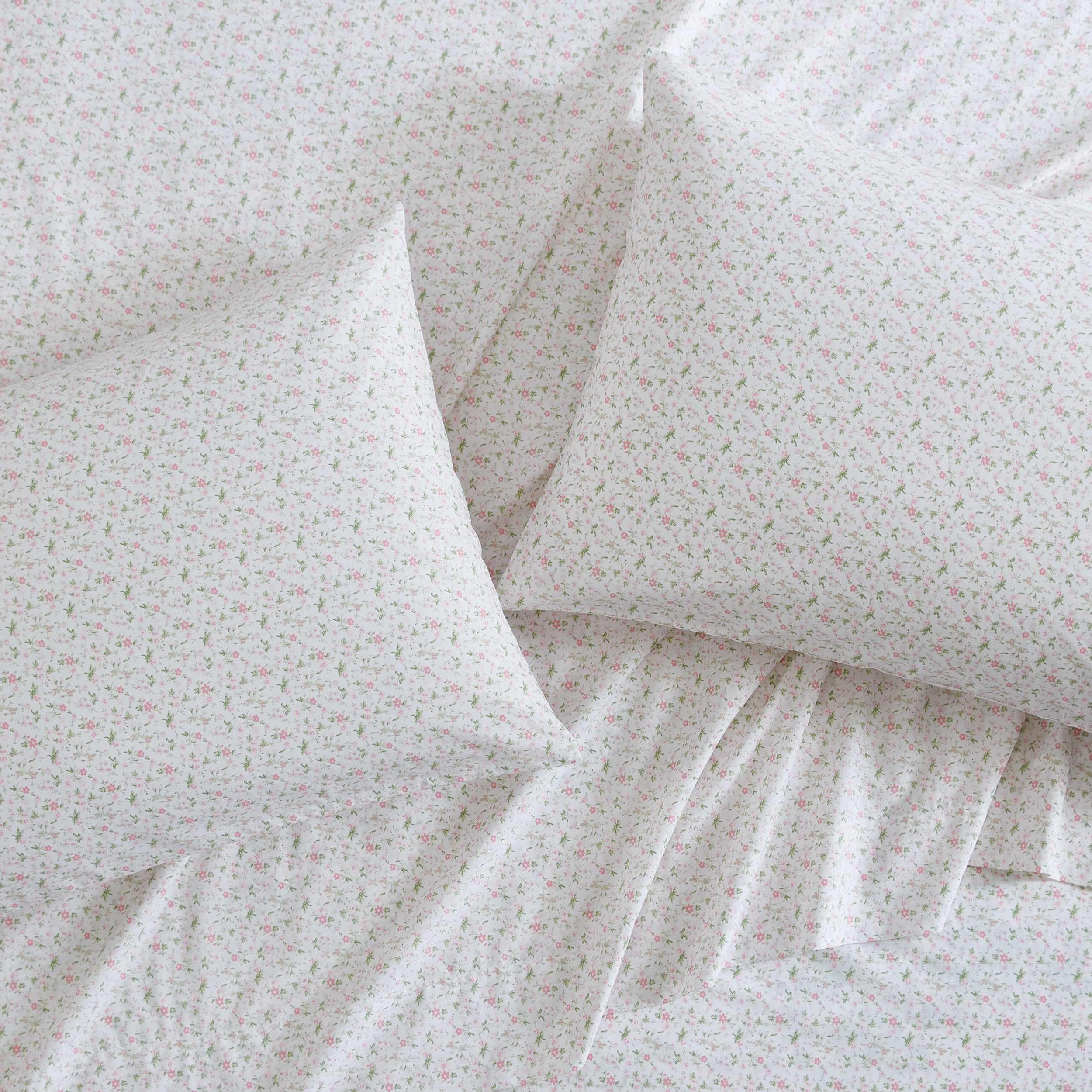 Laura Ashley Evie Pink fitted sheet elastic edge shown for secure fit