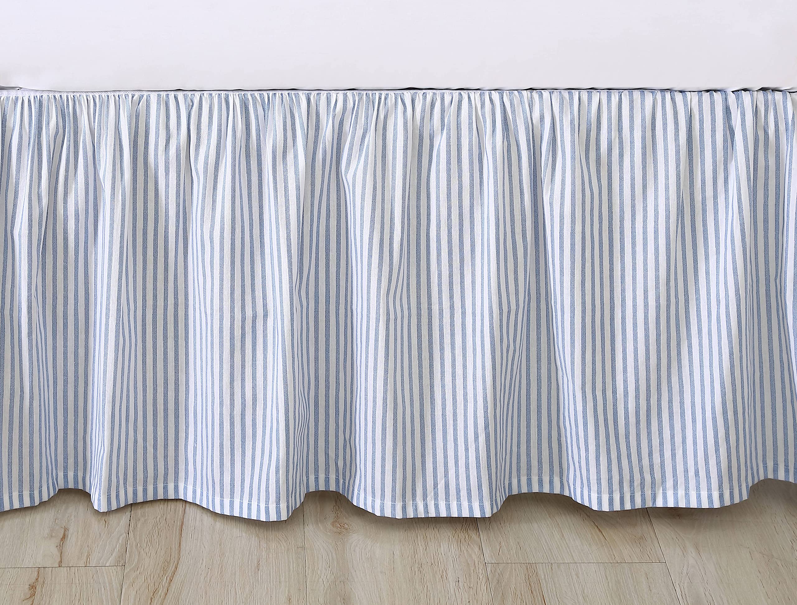 Laura Ashley bedskirt in use on a styled queen bed showing concealed under-bed storage