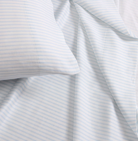 Laura Ashley pillowcases styled layered on pillows for a polished look