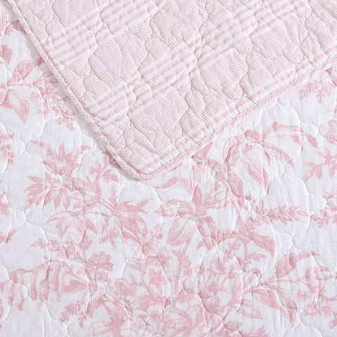 Laura Ashley quilt draped on bed illustrating full/queen coverage and cozy look
