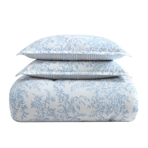 Laura Ashley shams and pillow arrangement creating coordinated bedroom styling