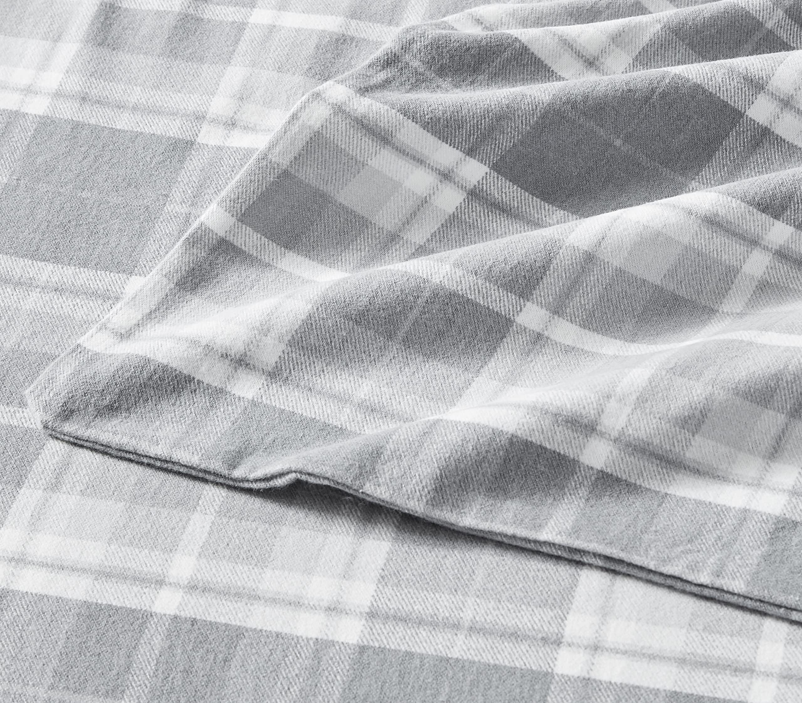 Laura Ashley sheets on a styled full bed portraying inviting, elegant bedroom look