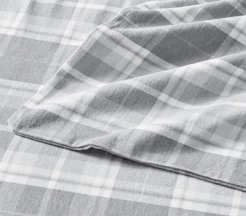 Laura Ashley sheets on a styled full bed portraying inviting, elegant bedroom look