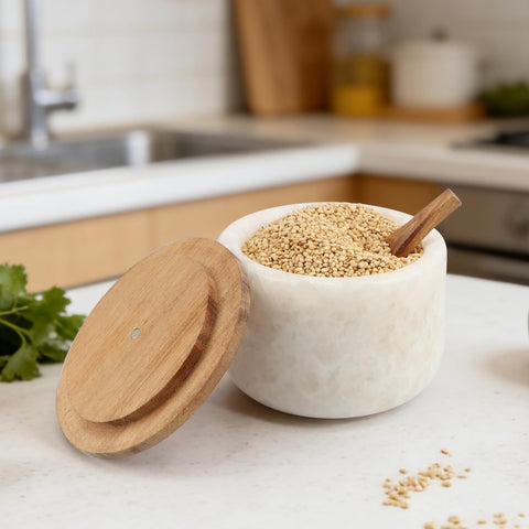 Lc.Courage cellar beside spoon for scale illustrating compact footprint and portion-control spoon