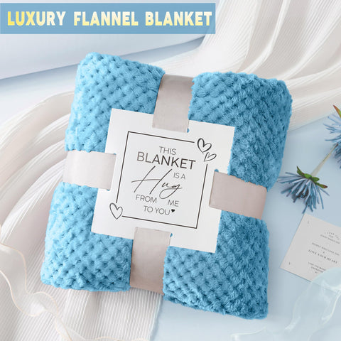 LE CADEAU ocean-scented candle burning to create soothing spa-like ambiance