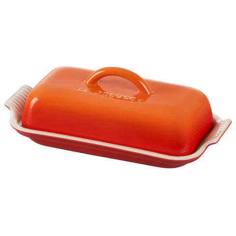 Le Creuset Heritage Butter Dish front view showing Flame color and compact shape for attractive storage