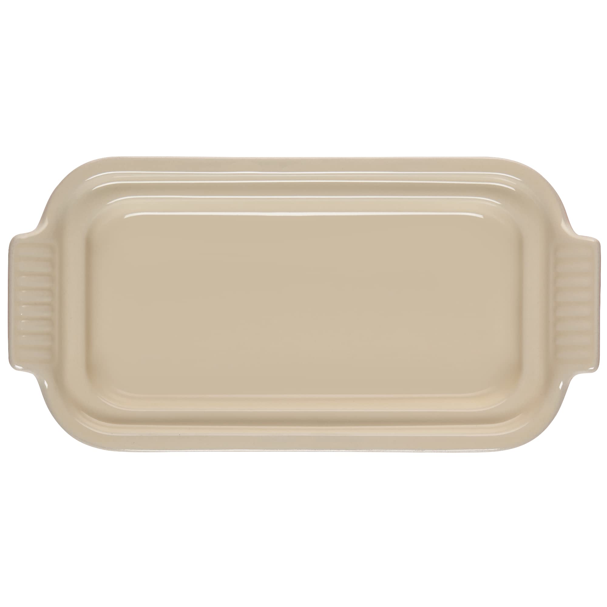 Le Creuset lid detail close-up highlighting glazed finish and snug-fit rim for protection