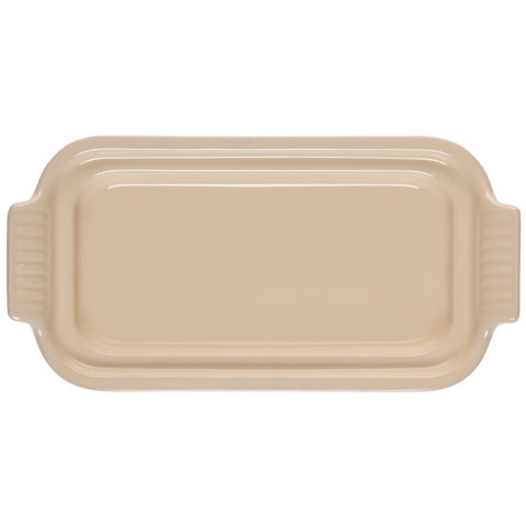 Le Creuset lid detail close-up highlighting glazed finish and snug-fit rim for protection