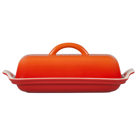 Le Creuset butter dish on breakfast table showing Flame glaze adding color to serving
