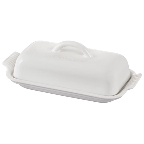 Le Creuset butter dish front view showing glossy white finish and elegant shape for refined storage