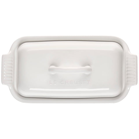 Le Creuset butter dish on table with bread demonstrating stylish serving and convenient use