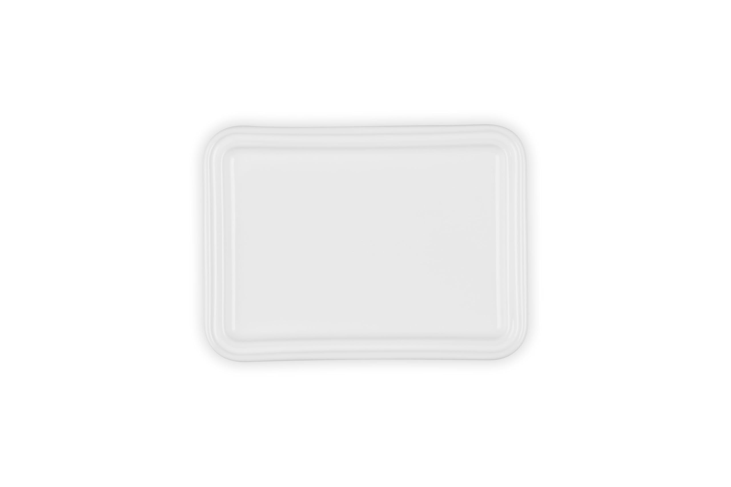 Le Creuset interior glaze view promoting easy butter release and cleanup