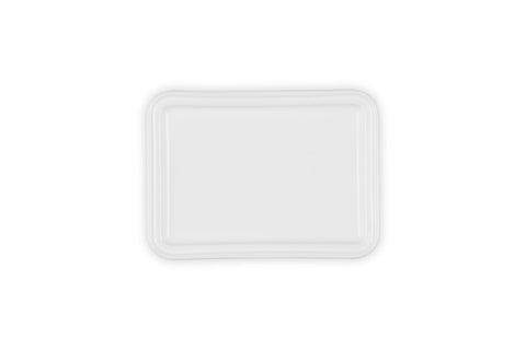 Le Creuset interior glaze view promoting easy butter release and cleanup