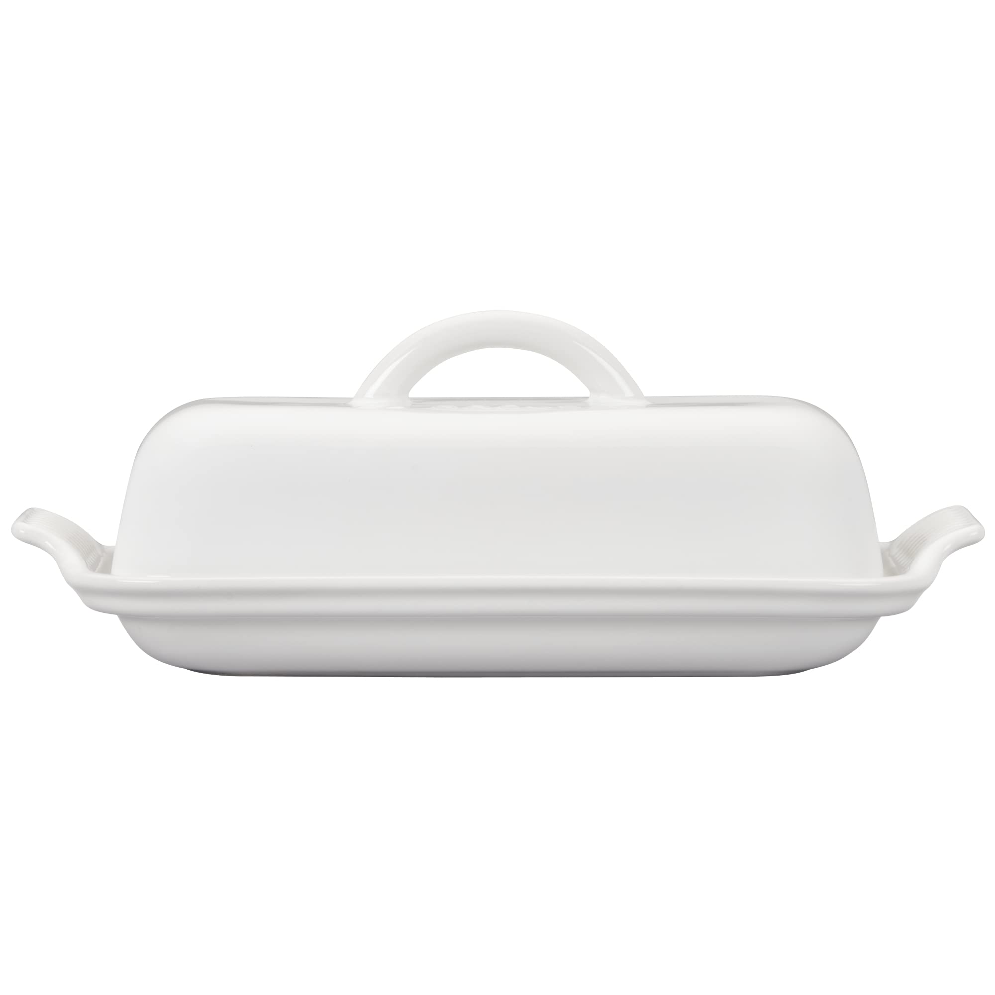 Le Creuset butter dish next to butter knife illustrating size and practical countertop scale