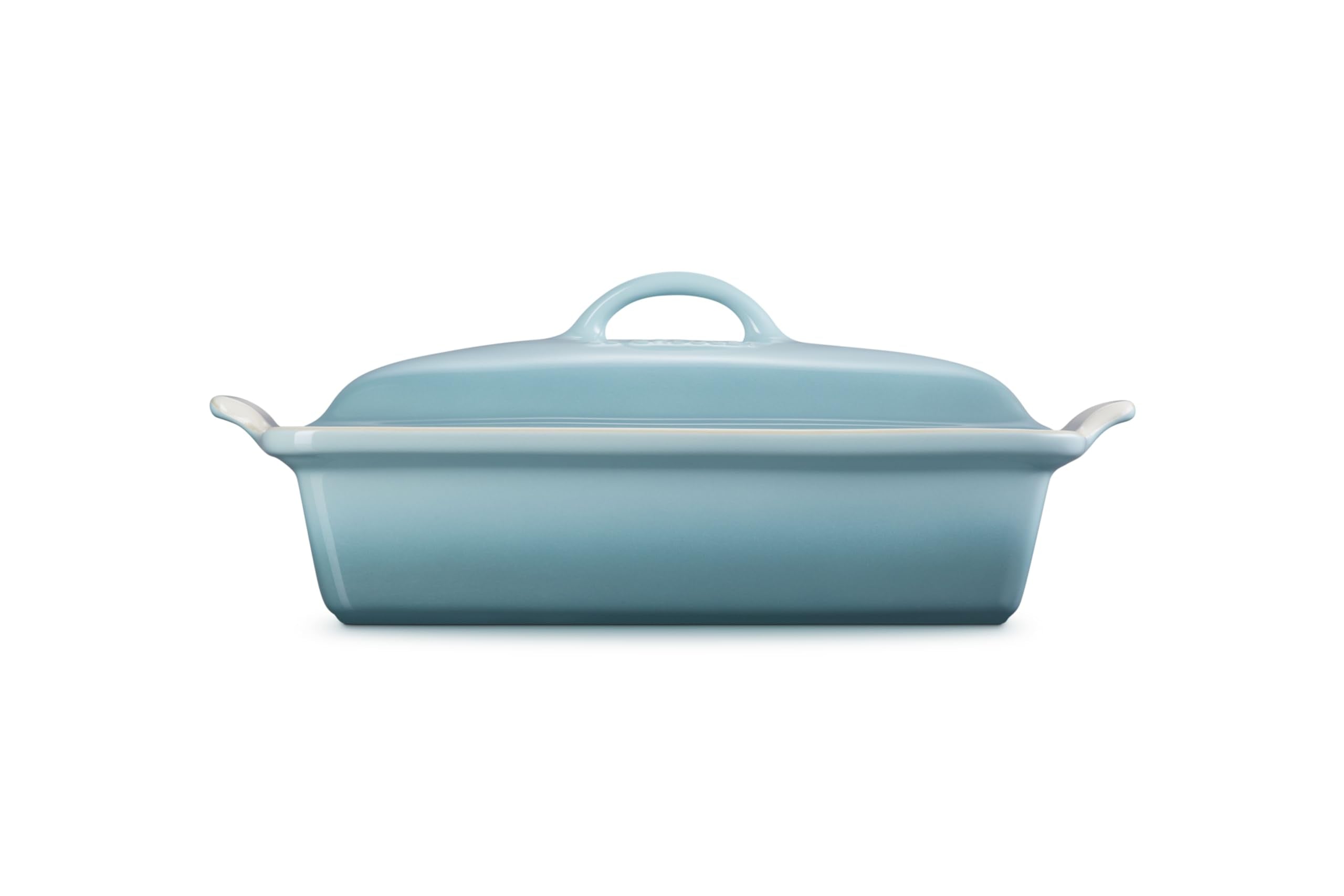 Le Creuset close-up of lid glaze highlighting Sea Salt durability and easy cleaning benefits
