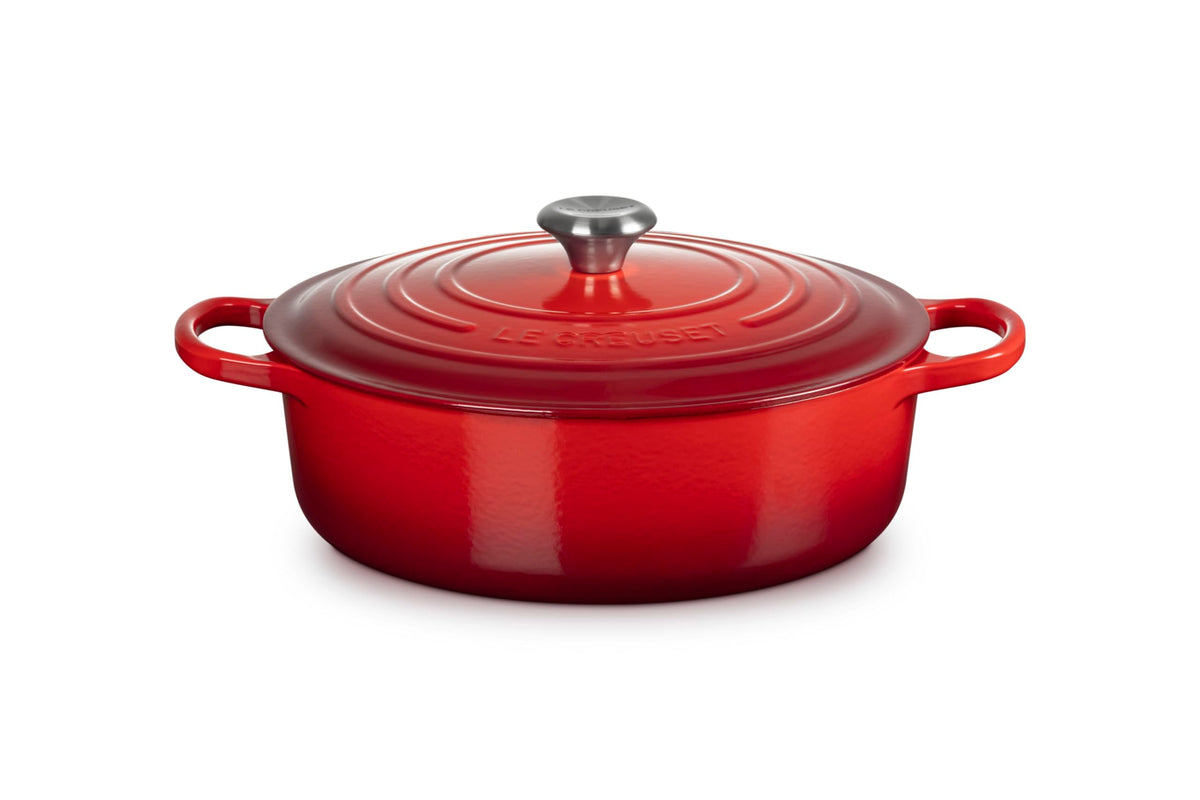 Le Creuset front view showing cerise enamel and sturdy handles for visual appeal