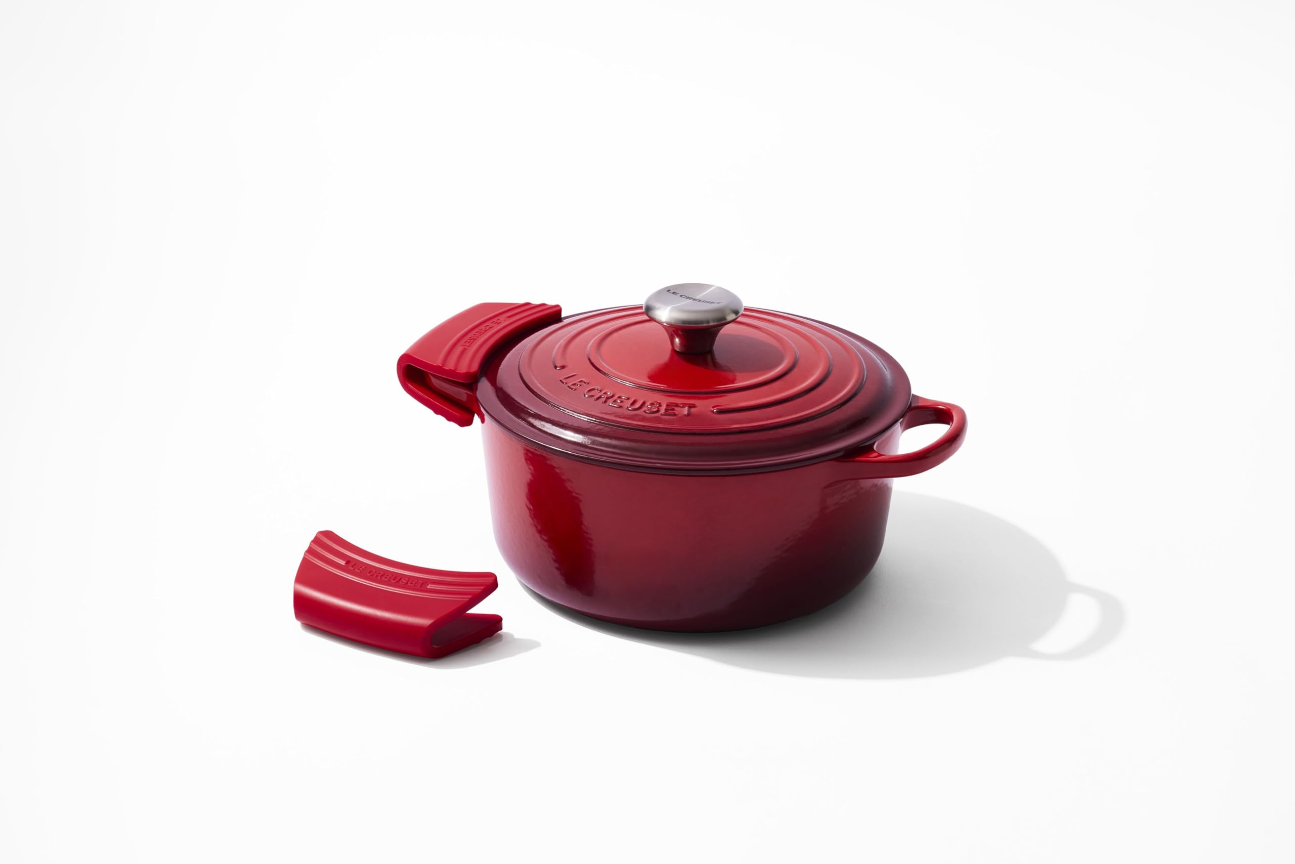 Le Creuset cerise grips on kitchen counter adding color and protection
