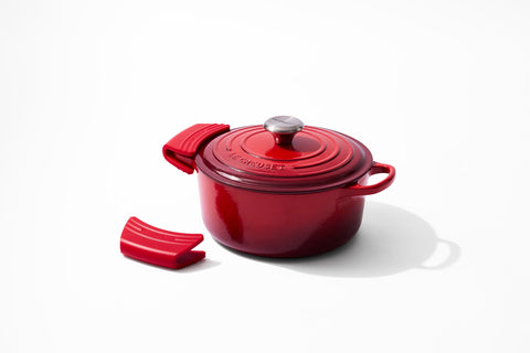 Le Creuset cerise grips on kitchen counter adding color and protection