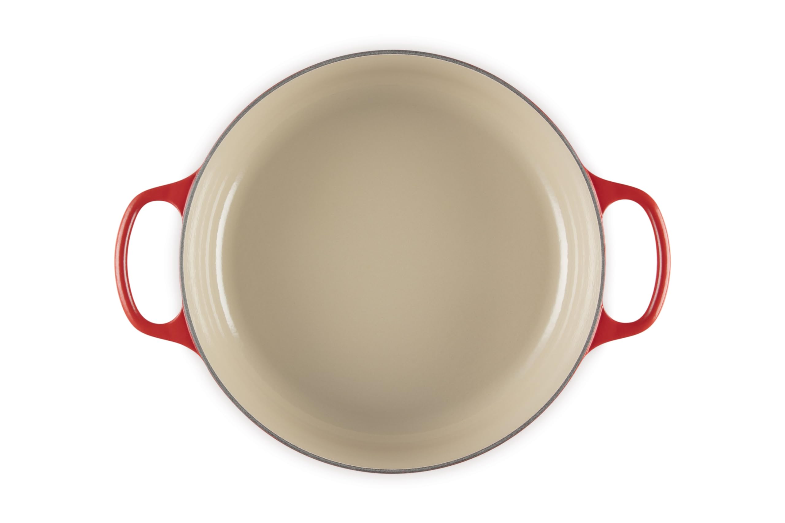 Le Creuset interior closeup showing sand-colored enamel for easy browning and cleanup