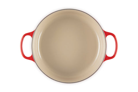 Le Creuset interior closeup showing sand-colored enamel for easy browning and cleanup