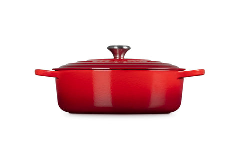 Le Creuset side profile highlighting wide base and shallow cooking surface benefit