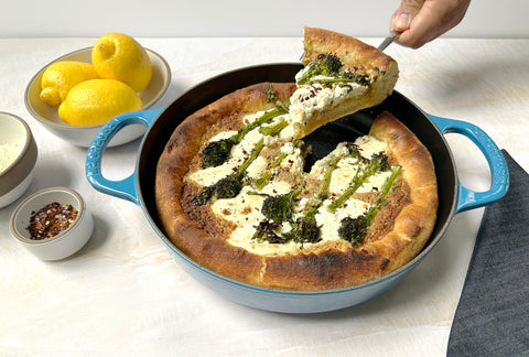 Le Creuset pan beside a spatula showing 11-inch scale for adequate family portions benefit