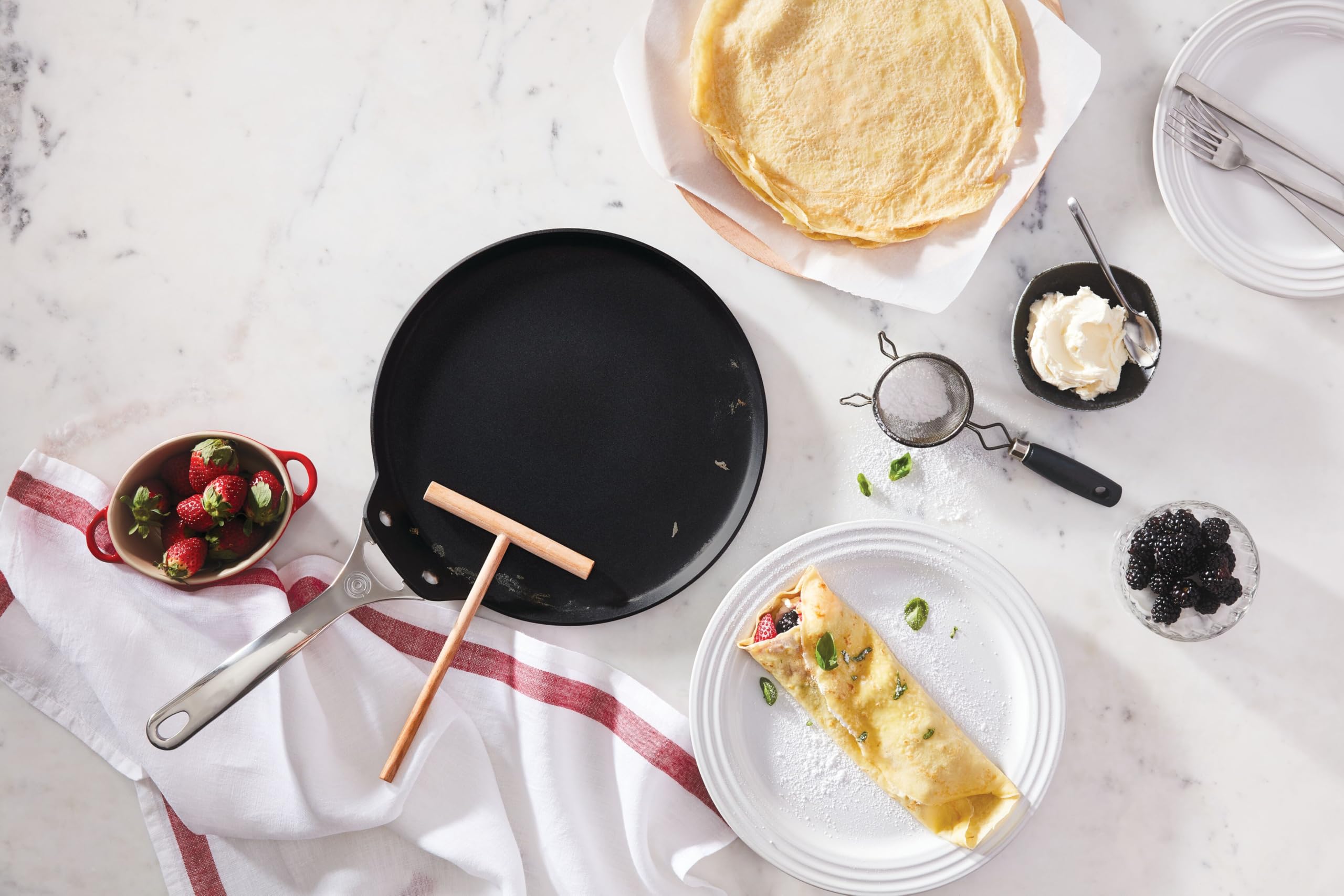 Le Creuset crepe cooking in pan demonstrating flawless release and browning