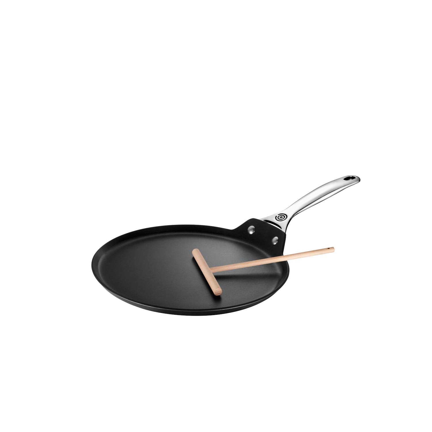 Le Creuset pan held in hand showing 11-inch scale and balanced weight