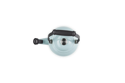 Le Creuset interior showing minimum and maximum fill markings for safe use