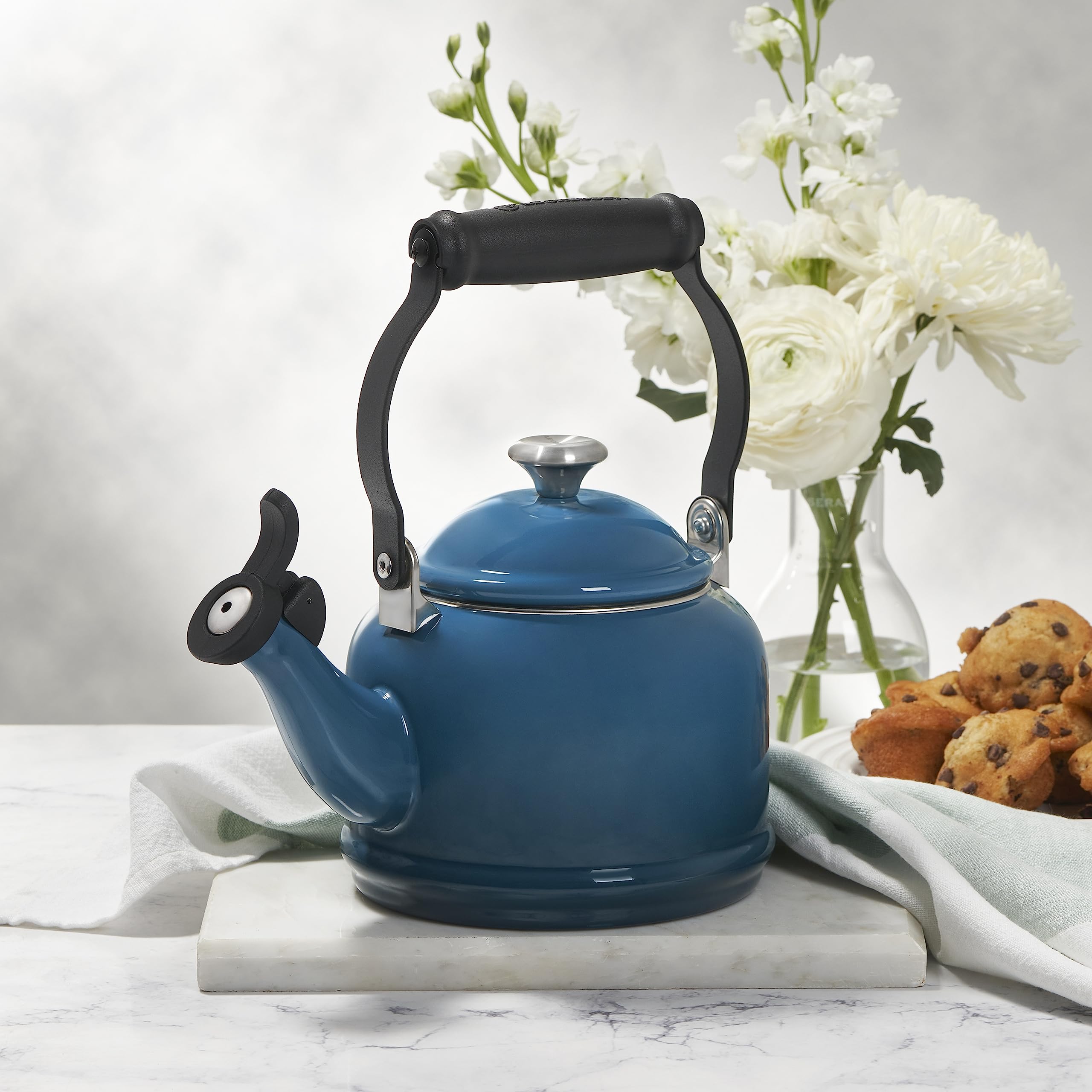 Le Creuset kettle steaming on stovetop illustrating fast heating performance
