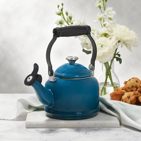 Le Creuset kettle steaming on stovetop illustrating fast heating performance
