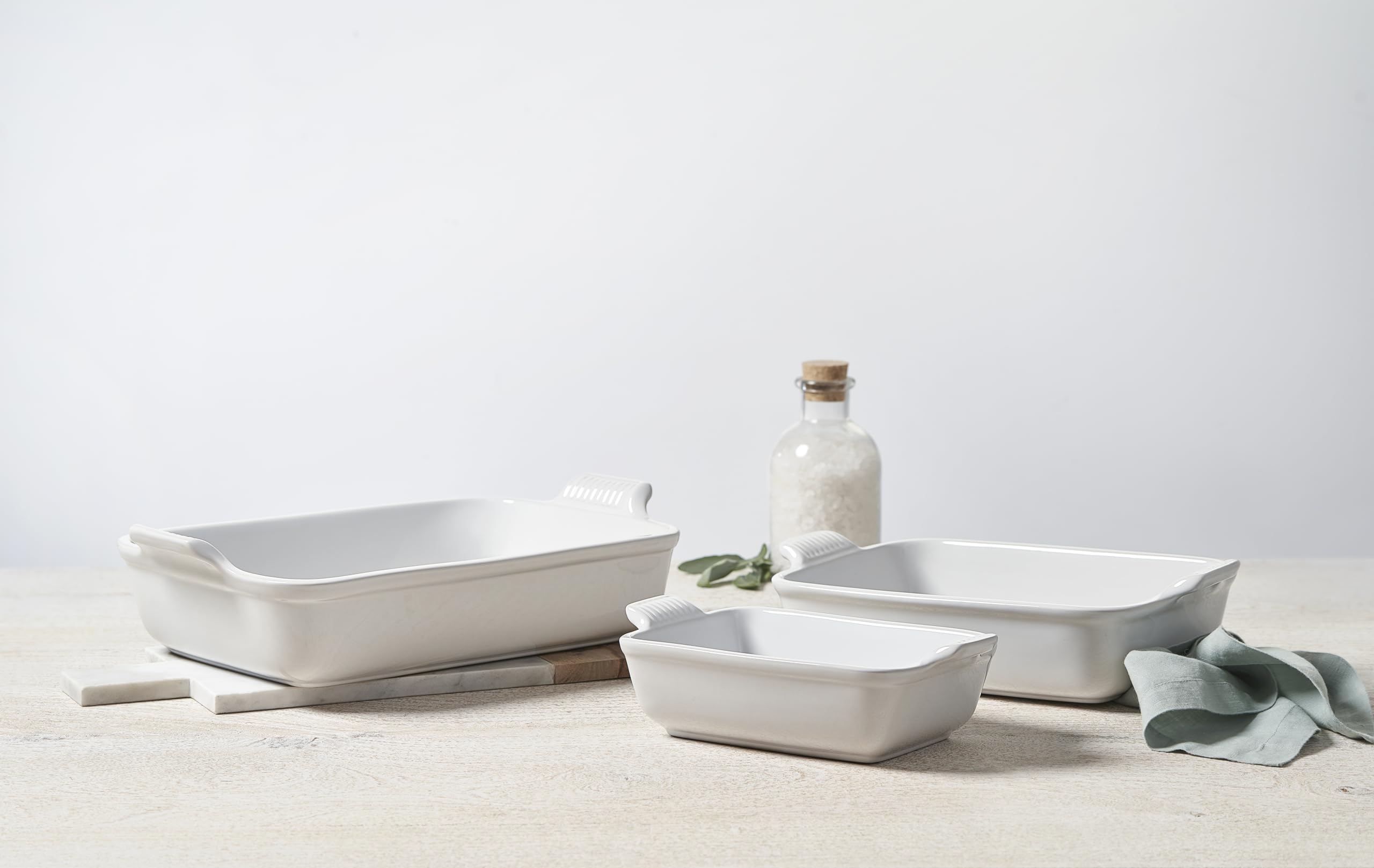 Le Creuset baking dishes in oven with casserole inside showing even heat and browning benefit