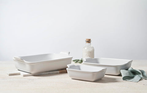 Le Creuset baking dishes in oven with casserole inside showing even heat and browning benefit
