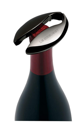 Le Creuset foil cutter held in hand showing size and comfortable handling
