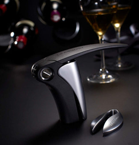 Le Creuset foil cutter on a dining table enhancing elegant service
