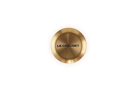 Le Creuset gold knob side profile highlighting brushed texture and heat resistance