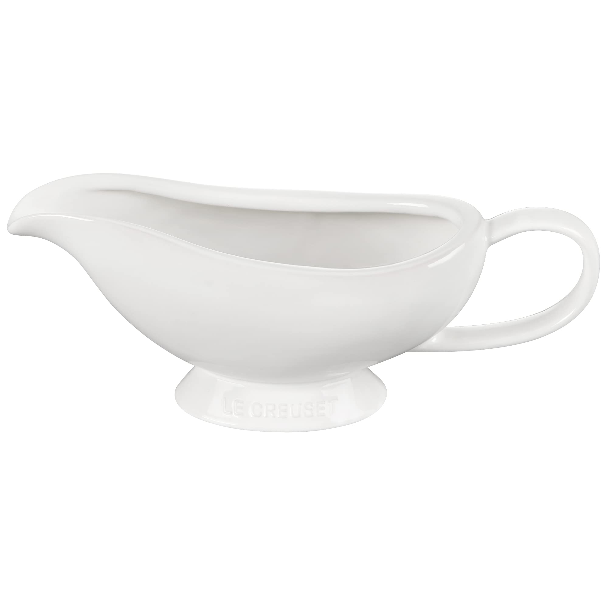Le Creuset gravy boat in use pouring sauce, keeping warmth and control