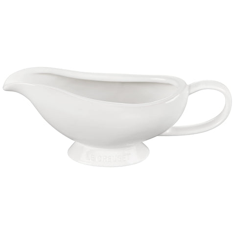 Le Creuset gravy boat in use pouring sauce, keeping warmth and control