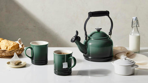 Le Creuset handle and stainless-steel knob showing secure grip and branded detail